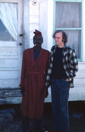 Diddley bow player Moses Williams with folklorist Dwight DeVane (?).