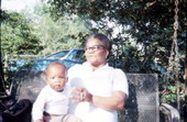 Midwife Annie Mae Taylor holding a baby - Jasper, Florida