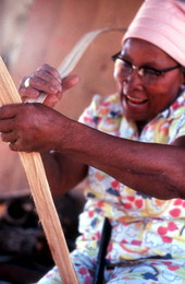 Lucreaty Clark peeling strips of white oak to make baskets