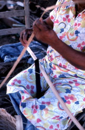 Basket maker Lucreaty Clark tearing white oak into strips