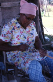 Basket maker Lucreaty Clark holding white oak strips