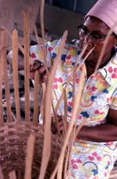 Lucreaty Clark weaving her white oak basket