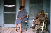 108 year old Ike Ward sitting on his porch with unidentified neighbor - Seville, Florida