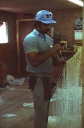 Billy Burbank III weaving a fishing net - Fernandina Beach, Florida