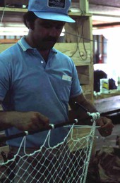 Billy Burbank III in the process of making a fishing net - Fernandina Beach, Florida