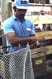 Billy Burbank III finishing the making of a fishing net - Fernandina Beach, Florida