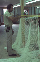 Billy Burbank III working on a fishing net - Fernandina Beach, Florida