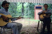 Gamble Rogers (R) and blues guitarist/singer Roy Book Binder performing at 1982 Florida Folk Festival- White Springs, Florida