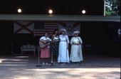 Evelyne Bernstein and Thelma Boltin singing folk songs while Betsy Bouwhiuzen plays guitar - White Springs, Florida