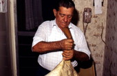 Nikitas Tsimouris preparing to play a tsambouna - Tarpon Springs, Florida