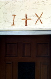 Symbols in sheep's blood over Nikitas Tsimouris' door - Tarpon Springs, Florida.