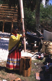 Susie Jim Billie pounds corn - Ochopee, Florida