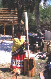 Susie Jim Billie pounds corn - Ochopee, Florida