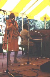 Mary McClain sings while Willie James plays piano - White Springs, Florida