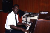 Alex McBride playing blues piano at Pine Estates Elementary School - Jacksonville, Florida