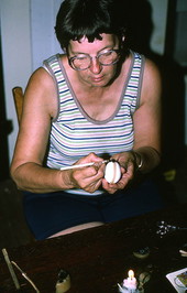 Evelyn Coskey working with stylus during Polish egg decoration (pysanky) - Starke, Florida