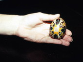 Hand of Jomarie Monsorno holding a Ukrainian Easter egg she made - Jacksonville, Florida