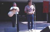 Nikitas Tsimouris plays a tsambouna while Tony Tsimouris talks - White Springs, Florida