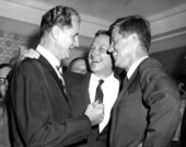 U.S. Senator George A. Smathers sharing a laugh with Governor Collins and President Kennedy.