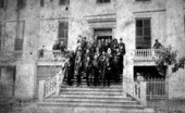 Governor Edward Aylsworth Perry with men on the steps of the Capitol.