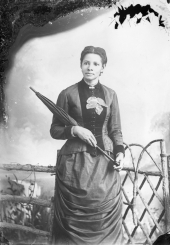 Woman holding parasol.