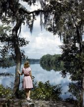 Photographer's daughter, Lois Duncan Steinmetz, admiring the scenery of the Suwannee River.