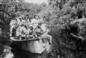 Postcard of group arriving at the Koreshan Unity settlement by boat during the Solar Festival.