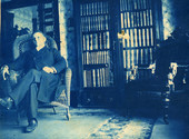 Dr. Cyrus Reed Teed, founder of the Koreshan Universology, sitting in his Chicago office.