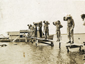 Postcard showing Koreshans taking produce off Mound Key to market via the "The Estero".