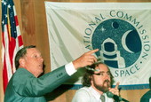 Neil Armstrong and Leonard David gesture during a meeting of the National Commission of Space - Tallahassee, Florida.