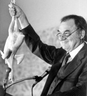 Former Governor Claude Kirk holds up a chicken to emphasize a point - Tallahassee, Florida