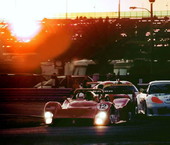 Cars running the Rolex 24 endurance race at sunset - Daytona Beach, Florida