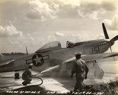 P-51 Mustang fire being extinguished at Sarasota Army Air Base.