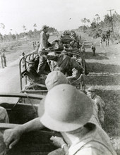 Close-up view showing convoy of airmen from the 97th Bombardment Group stopped along U.S. 41.