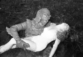 Ginger Stanley in the grip of the Gill-Man for promo still at Silver Springs.