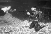 Ricou Browning shooting speargun underwater at Silver Springs.