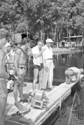 Director Jack Arnold speaking to underwater cameraman Scotty Welbourne on the set of "Revenge of the Creature" movie.