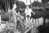 Director Jack Arnold, right, and Ricou Browning with crew on the set of "Revenge of the Creature" movie.