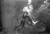 Ricou Browning breathing through air hose between takes of "Revenge of the Creature" movie at Silver Springs.
