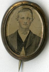 Ambrotype portrait of a man on a pin-back button.