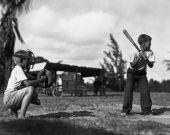 Boys playing baseball at Boynton playground.