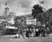Royal Poinciana guests standing beside the hotel train.