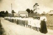 Mary McLeod Bethune with a line of girls from the school