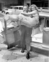Newt Perry carrying Nancy Tribble wearing her tail - Tampa, Florida.