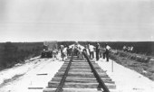 Men laying tracks at the Homestead A.F.B..