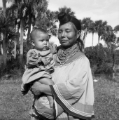 Seminole woman Leona Smith holding a child