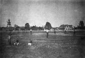 Boys watching baseball game - Apalachicola, Florida.