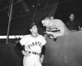 Pirate player at the Pittsburgh-Baltimore exhibition game chatting with general manager Branch Rickey