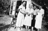 Marjory Stoneman Douglas beside the Coco Plum Woman's Club public library book wagon in South Miami.