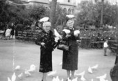 Marjory Stoneman Douglas and Mae Knight Clark with pigeons in Europe